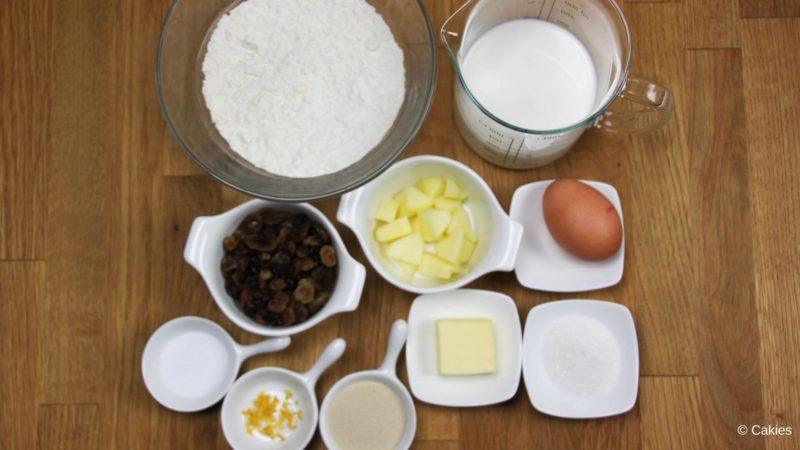 Ingredients for Oliebollen on a wooden surface. 
